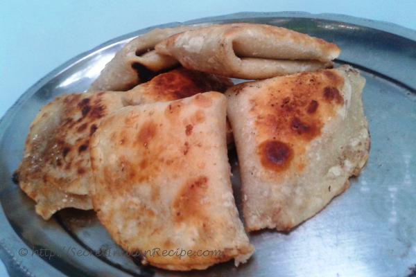 Manda (Sweetende Puffed rice powder stuffed in all-purpose flour )