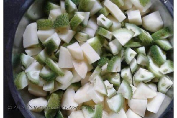 photo of kakrol tarkari (teasle gourd with fish head and soya nuggets )