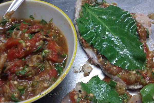 The fire roasted aubergines and tomatoes are on the left. The spinach leaf is set thus on the marinated fillet.