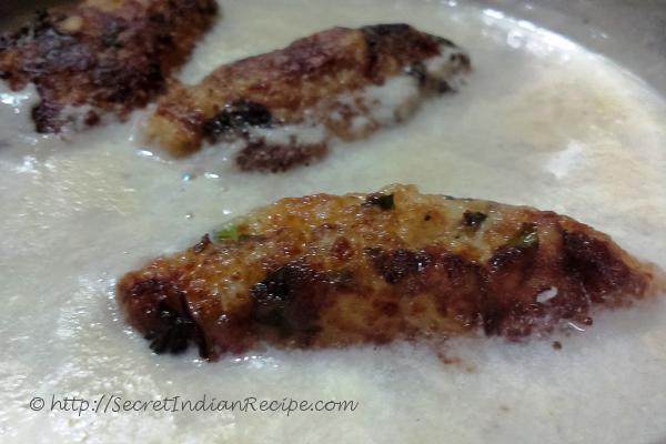 photo of malai kofta is white gravy (cottage cheese and potato dumplings in cashew gravy)