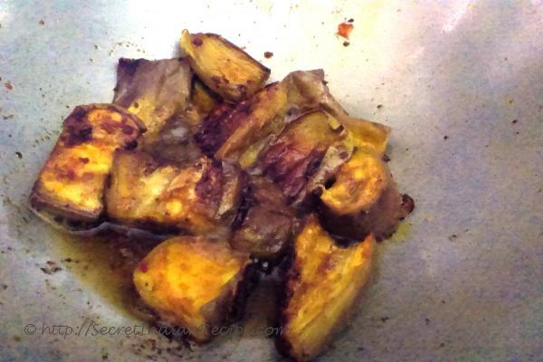 photo of begun baahari (egg plant cooked in mustard and poppy seed gravy)