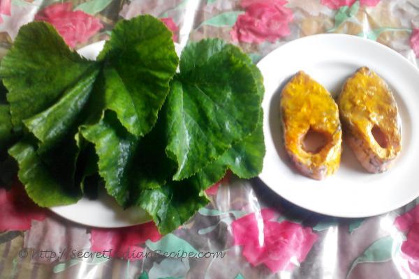 photo of raw fish and Pumpkin leaf