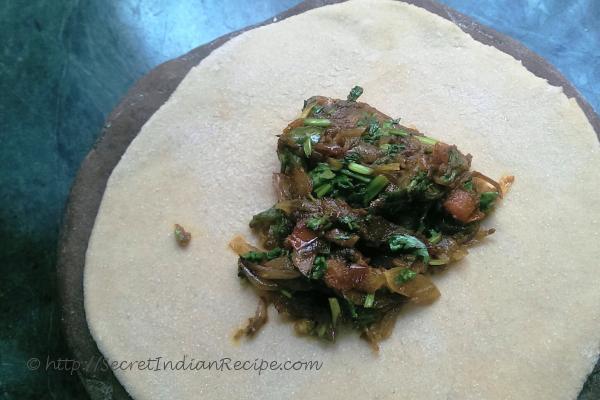 photo of pyazi masala paratha (onion stuffed flat bread)