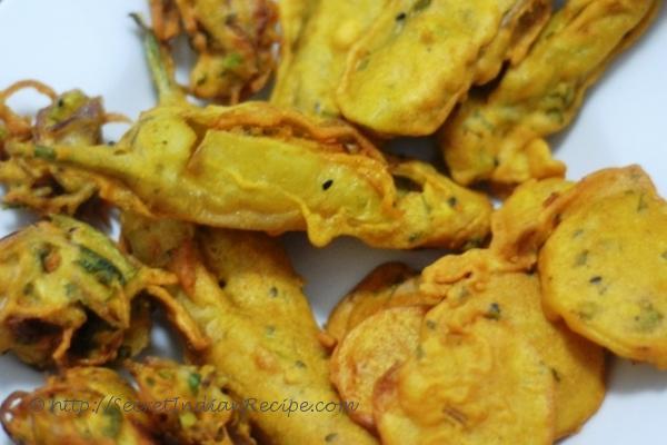 photo of mixed pakoda platter (indian street food)