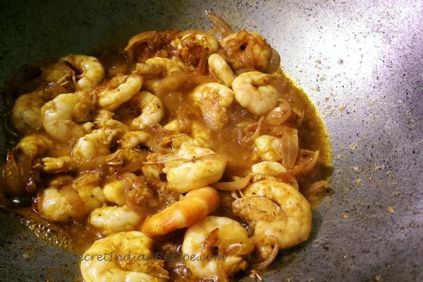 photo of saag chingri (prawns cooked with red spinach)