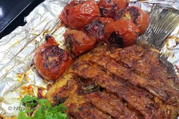 photo of baked karimeen (pearl spot)