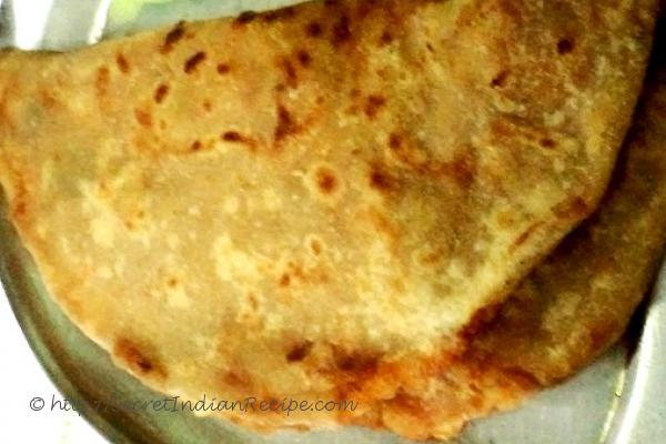 photo of badami aloo paratha (chapatti with potato and crushed potato filling