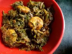 photo of saag chingri (prawns cooked with red spinach)
